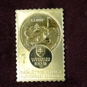 Plaketa s vyobrazením první památné mince